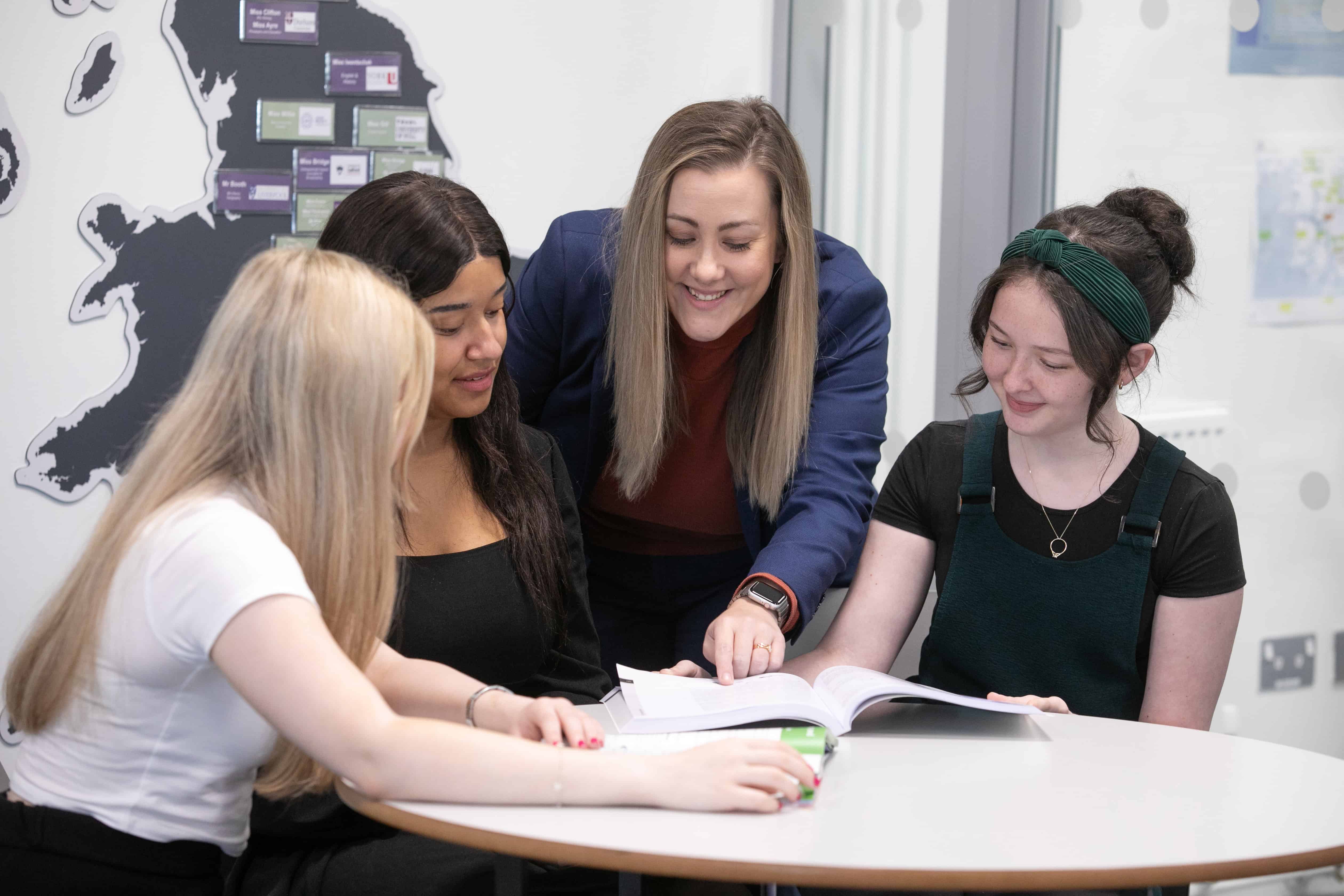 Miss Bridge in discussion with Sixth Form students. 