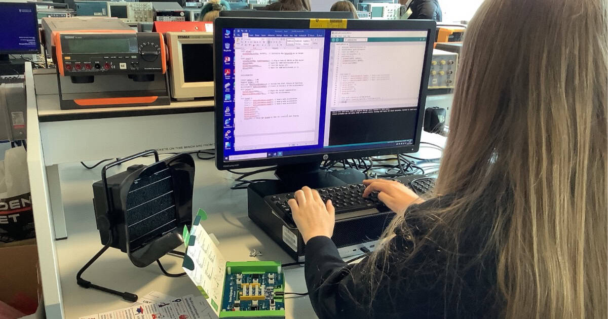 Student programmes on a computer during 'Girls into Electronics' at University of Liverpool